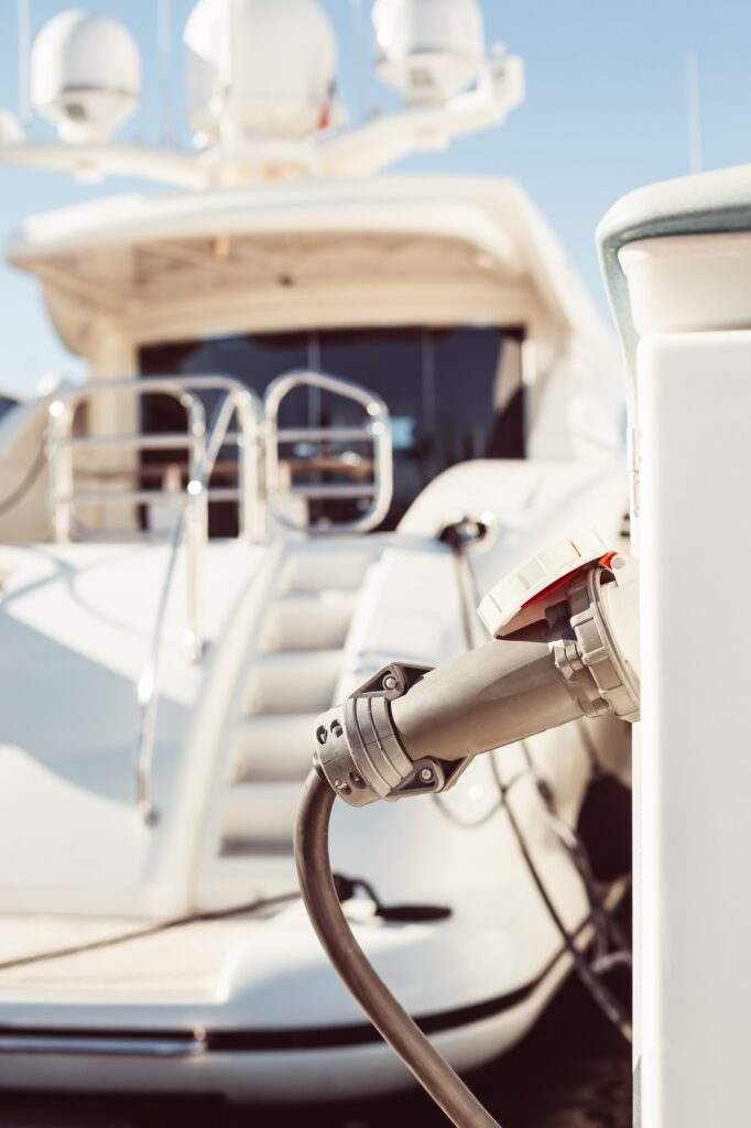 Moored yachts charching with fuel and electricity